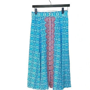 nanette lepore 100%  silk resort /summer skirt w deep slits at the front & back